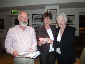 Linda collects Nearest the Pin prize from Hilda