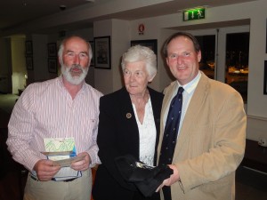 The Commodore accepts the winner's prize.